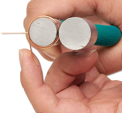 Wire being wrapped around pliers